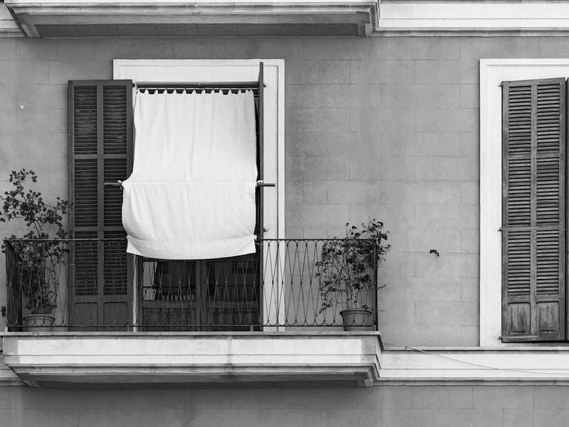 Balcony and rustic window shutters of old mediterranean house