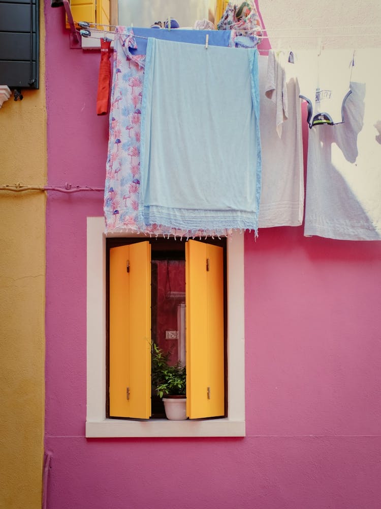 Italian Shutters Window With Laundry