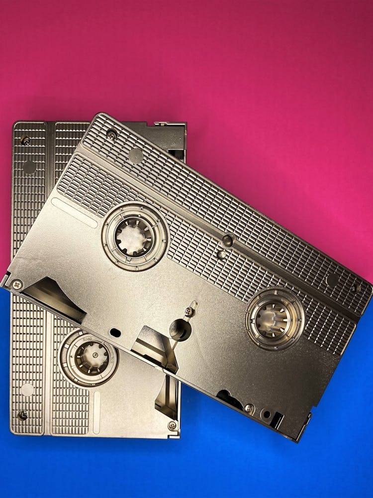 Gold VHS Tapes on Blue and Red