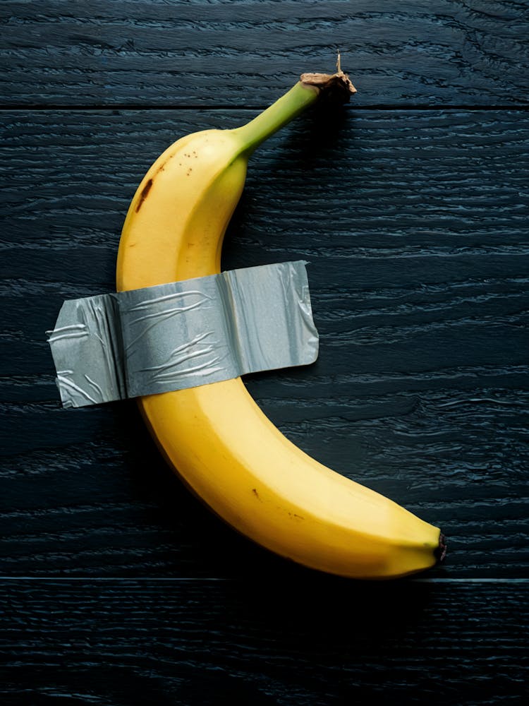 Duct Tape Banana, black background, Maurizio Cattelan