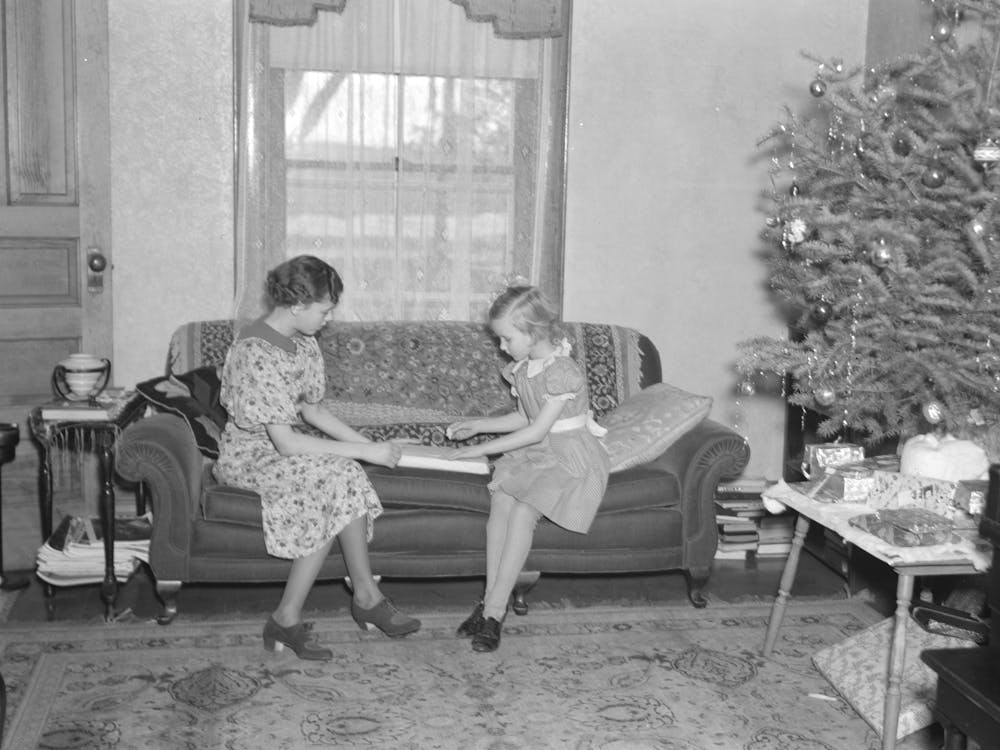 Children Of H H Tripp Wrapping Presents For Christmas, Near Dickens, Iowa, Tripp Operates His Mother S Farm By Russell