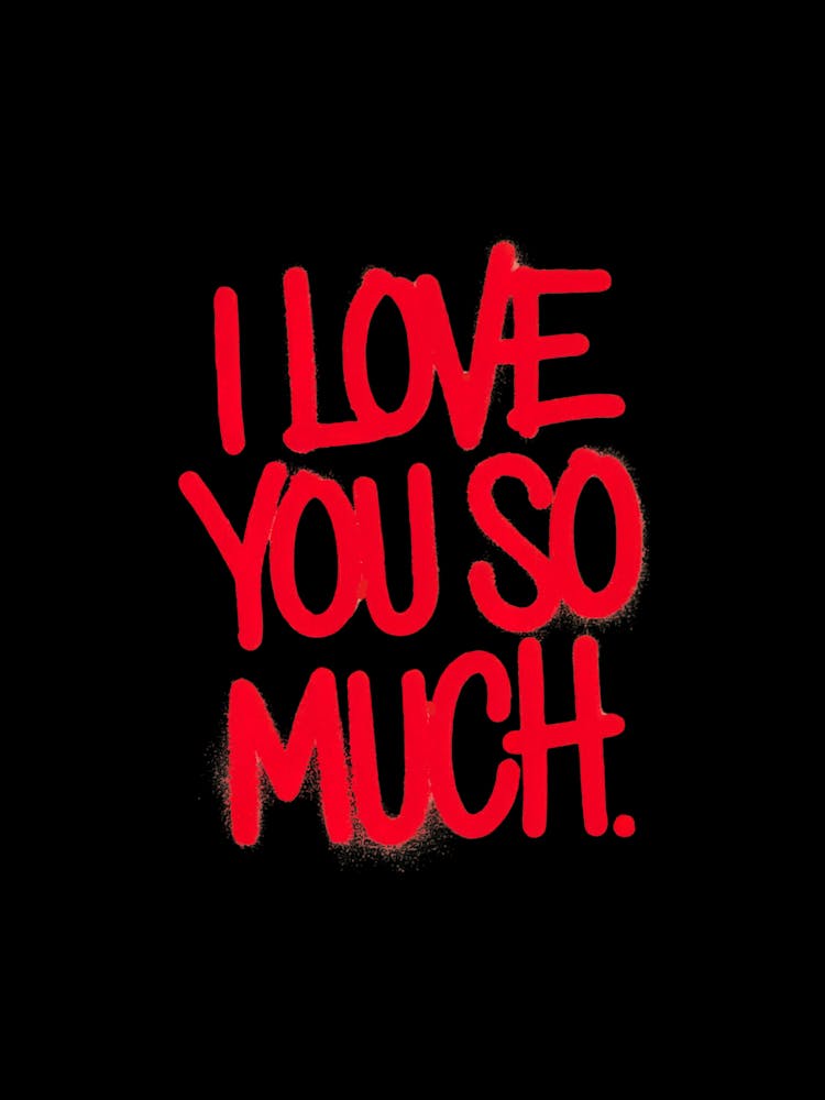 Red spray-painted message: I Love You So Much, black background.