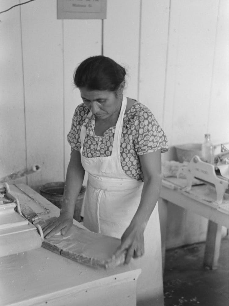 Mexican Woman Flattening And Shaping Tortillas Between Two Boards Hinged Together, San Antonio, Texas By Russell