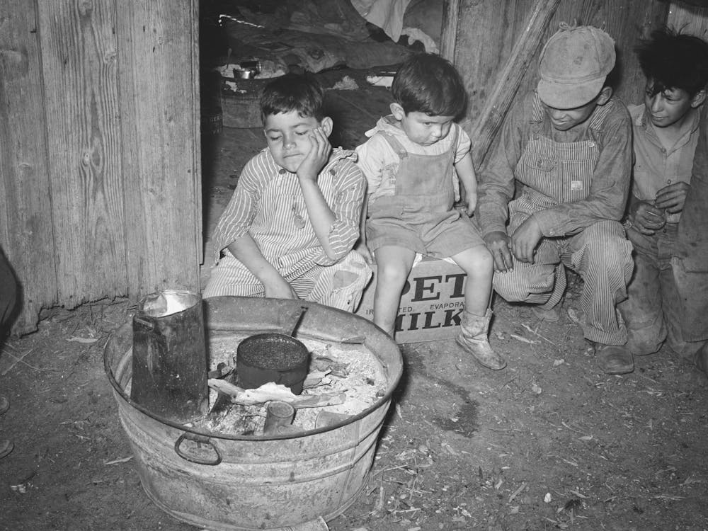 Mexican Children Sitting Outside Of Corral Before Fire Built In Wash Tub, Robstown, Texas By Russell Lee