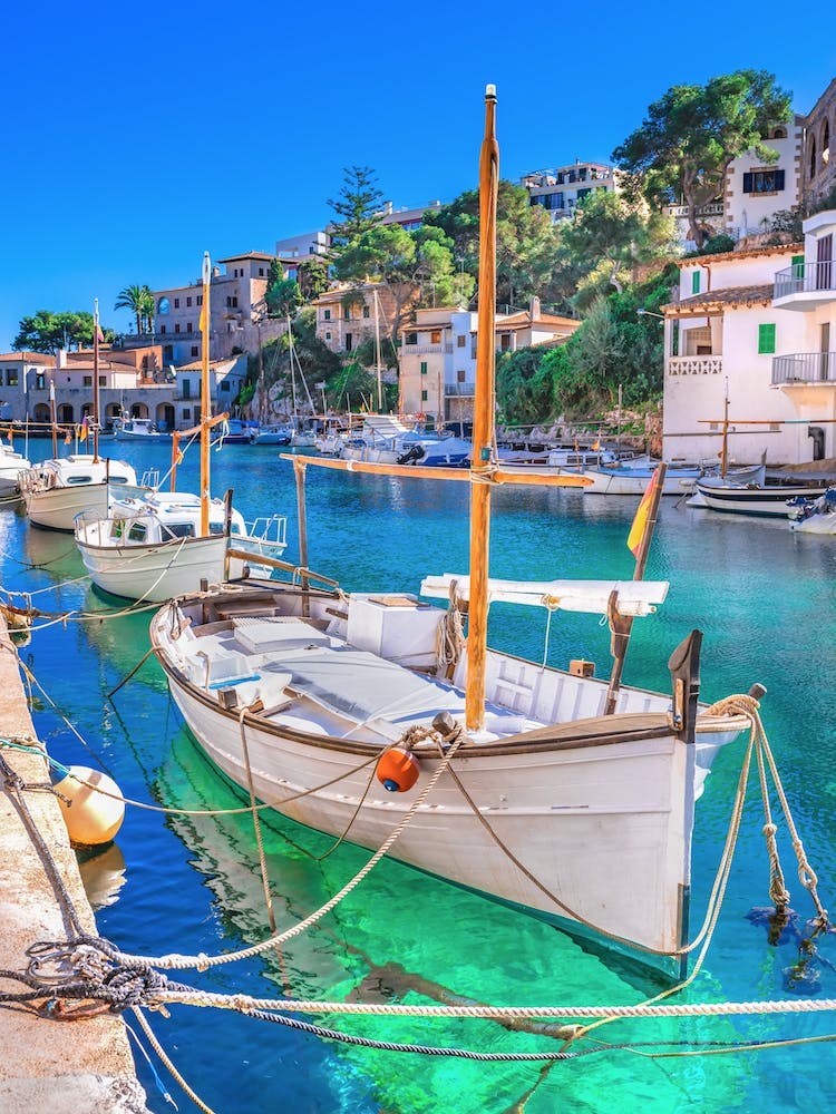 Cala Figuera with anchoring boats at beautiful seaside coast scenery on Mallorca island, Spain