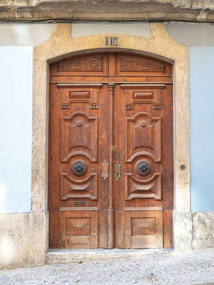 The wooden door nr. 19 in Alfama, Lisbon, Portugal - summer travel photography by Christa Stroo Photography
