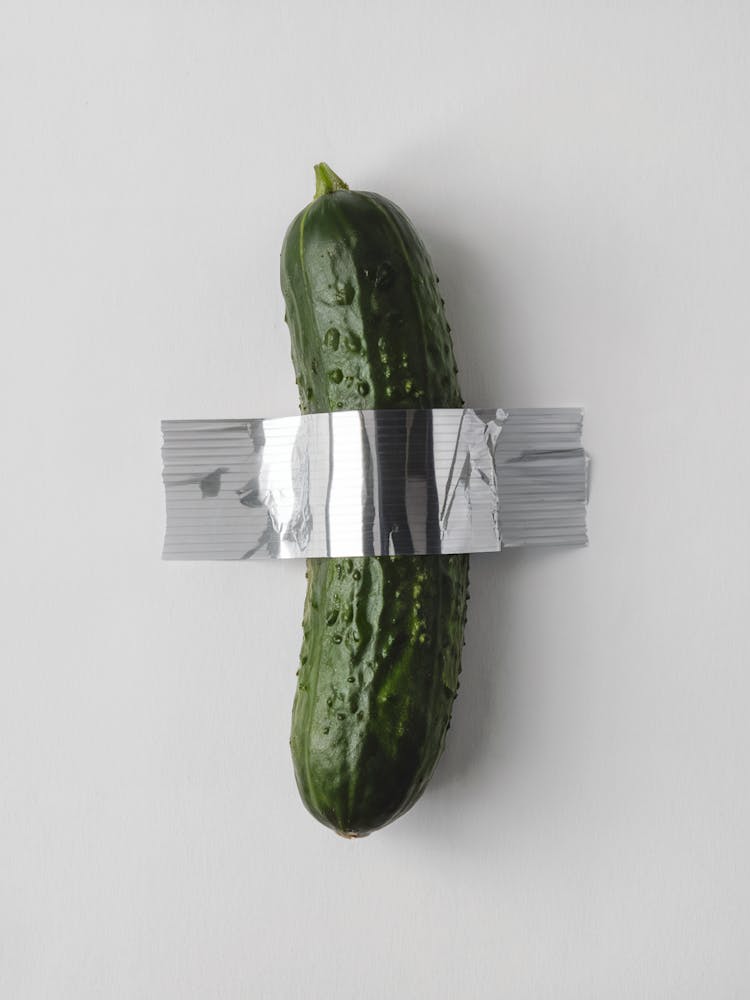 Duct Tape Pickle, white background, Maurizio Cattelan Style