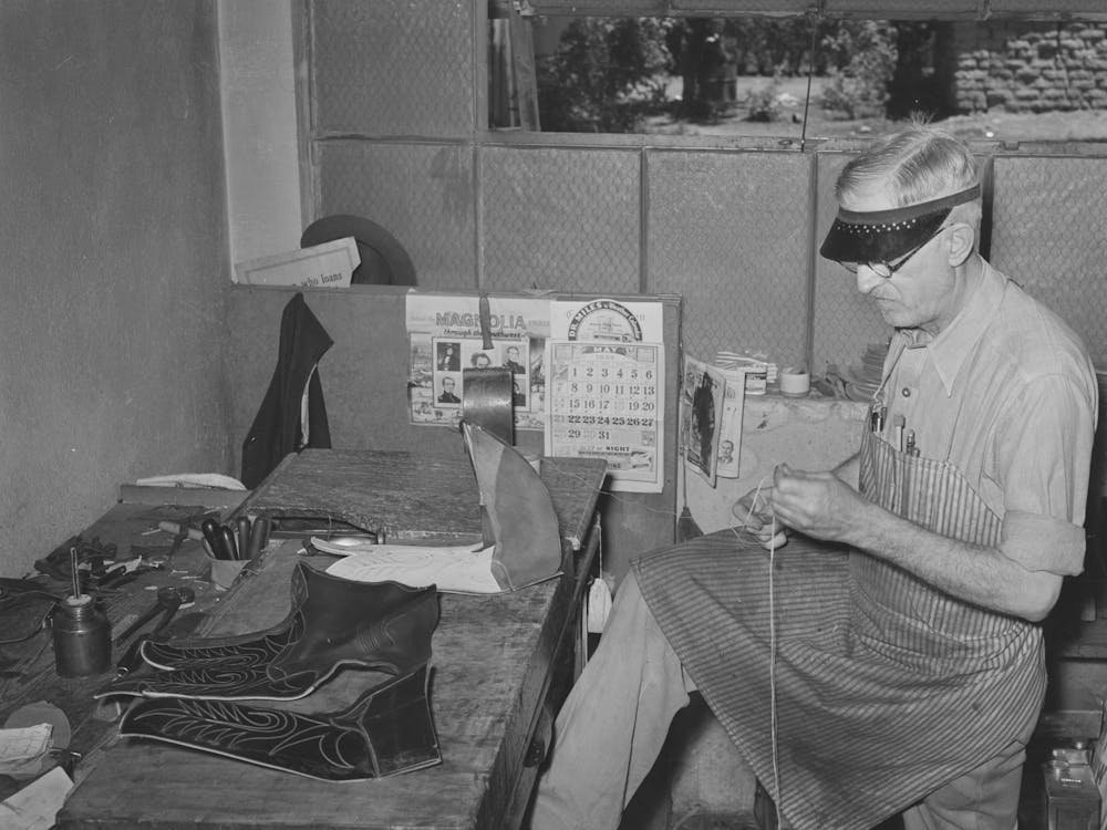Threading Needle To Sew Uppers Of Boots Together, Boot Shop, Alpine, Texas By Russell Lee