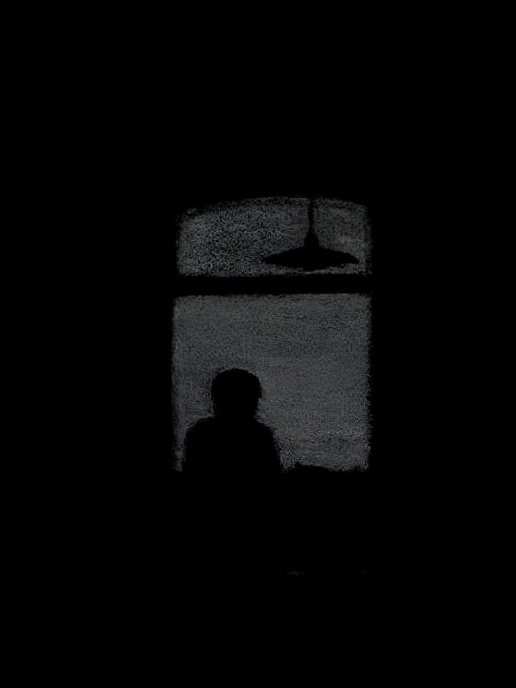Silhouette Of A Man In The Dark