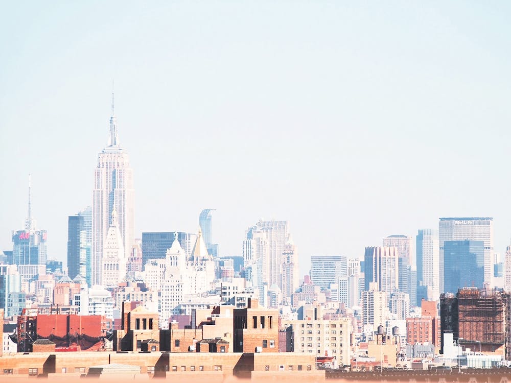 New York, USA I Retro vintage Manhattan skyline to industrial cityscape brick architecture and orange red aesthetic photography with the silhouette of skyscrapers like Rockefeller from the brooklyn bridge