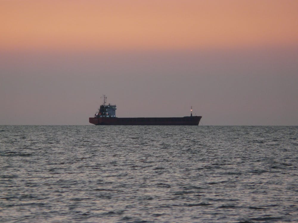 Cargo Ship At Sunset
