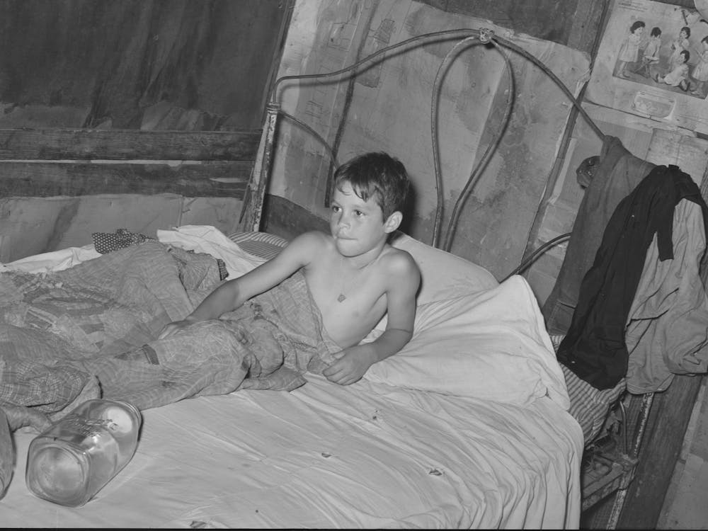 Young Son Of Agricultural Day Laborer In Bed, Near Vian, Oklahoma, Sequoyah County By Russell Lee