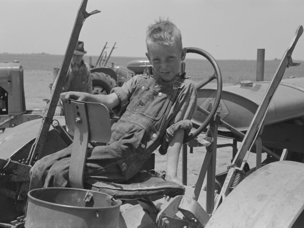 Son Of Day Laborer Sitting In Tractor Seat, Large Farm Near Ralls, Texas By Russell Lee