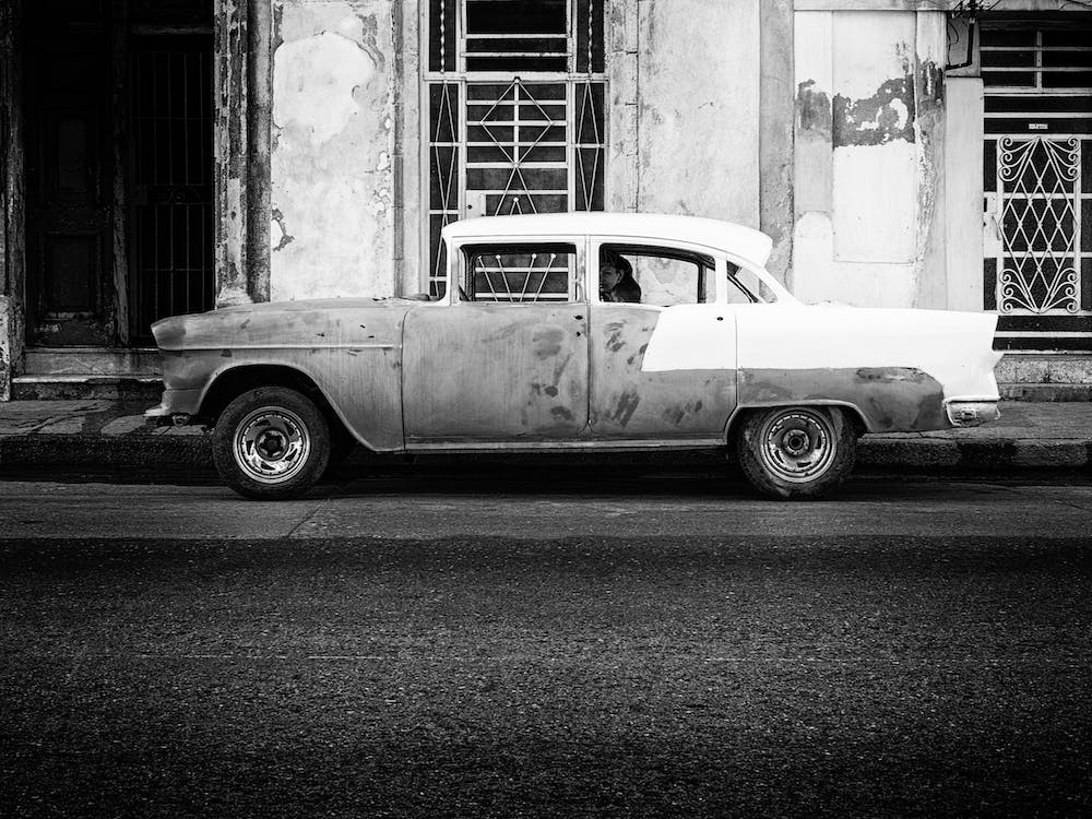 Woman & Child In Cuban Classic Automobile Havana