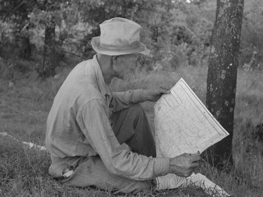 Untitled Photo, Possibly Related To White Migrant Agricultural Worker From Texas Studying The Map While Stopped