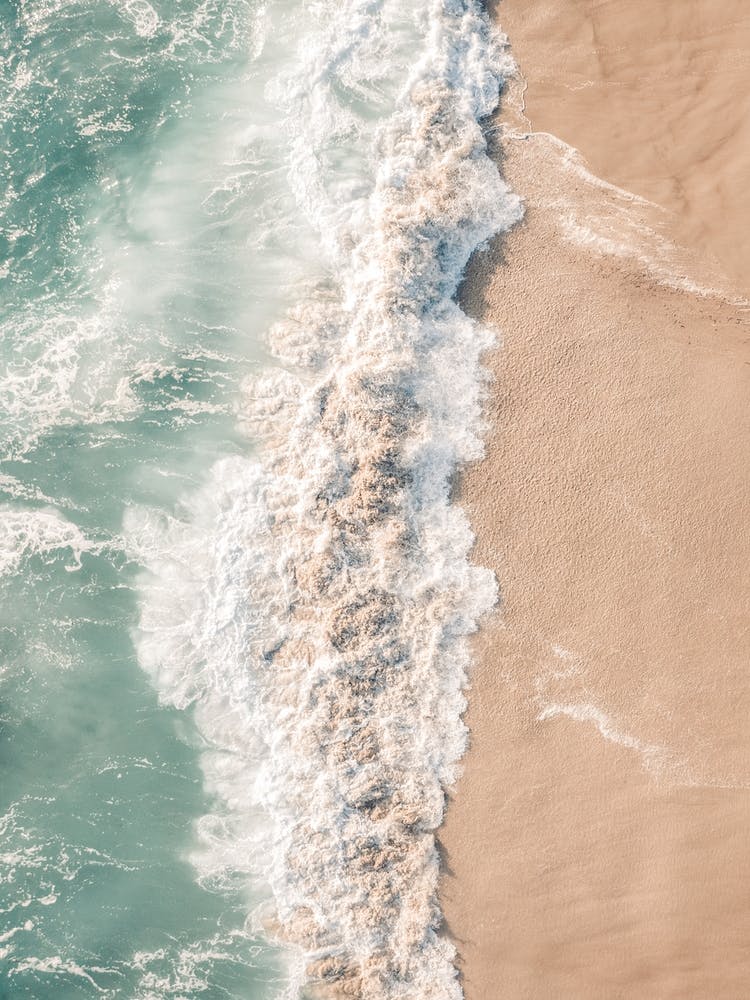 Beach Break Wave Crashing On Sand