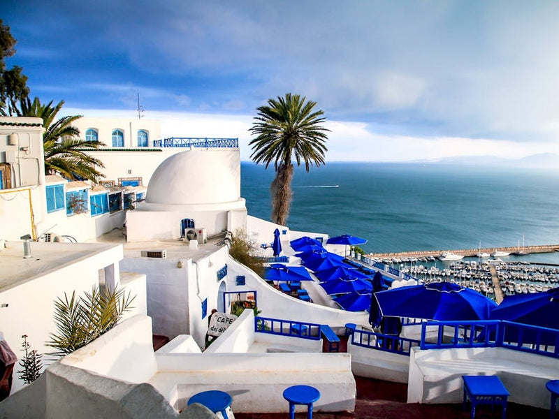 Blue Umbrellas On The Beach