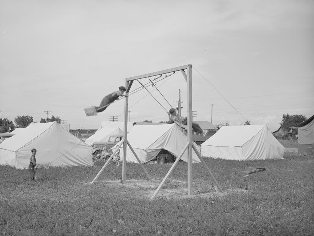 Children Playing In Mobile Unit Of Fsa (Farm Security Administration) Labor Camp, Nampa, Idaho By Russell Lee