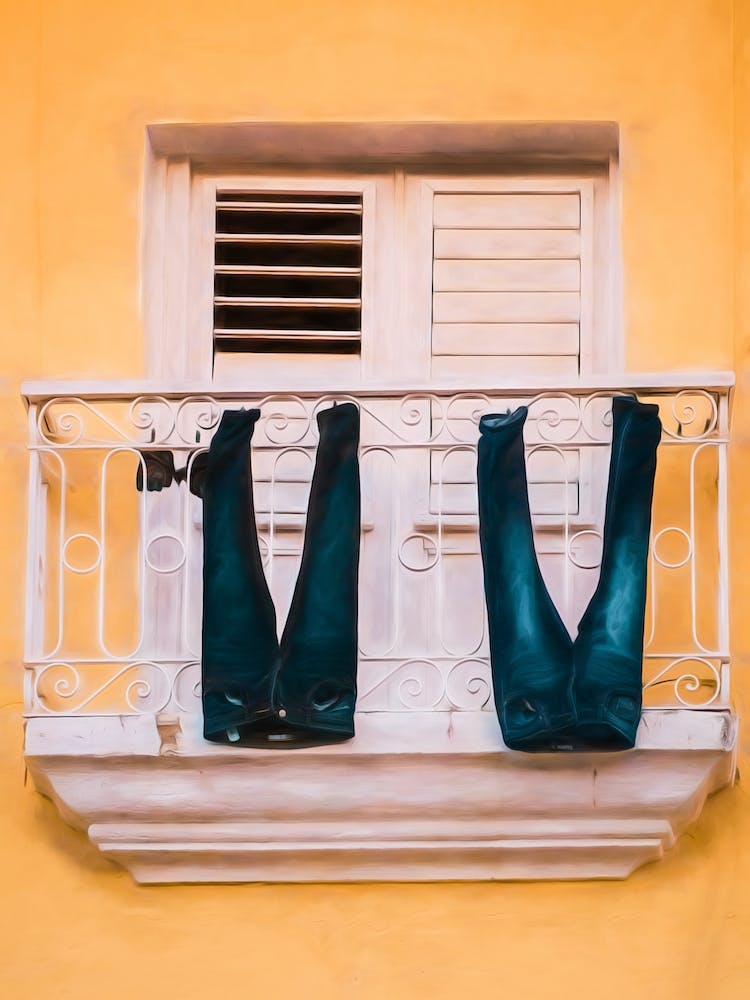 Jeans Drying From A Balcony