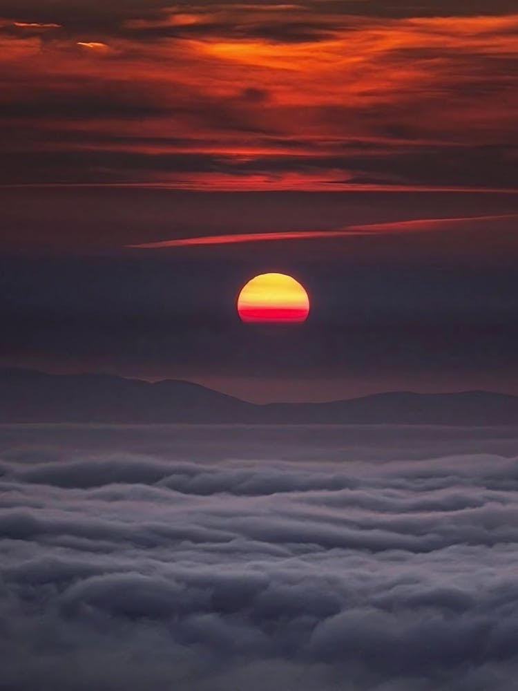 Sunrise Over The Clouds