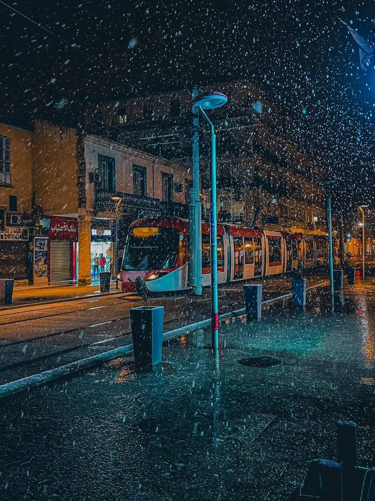 Snow Falling On A City Street