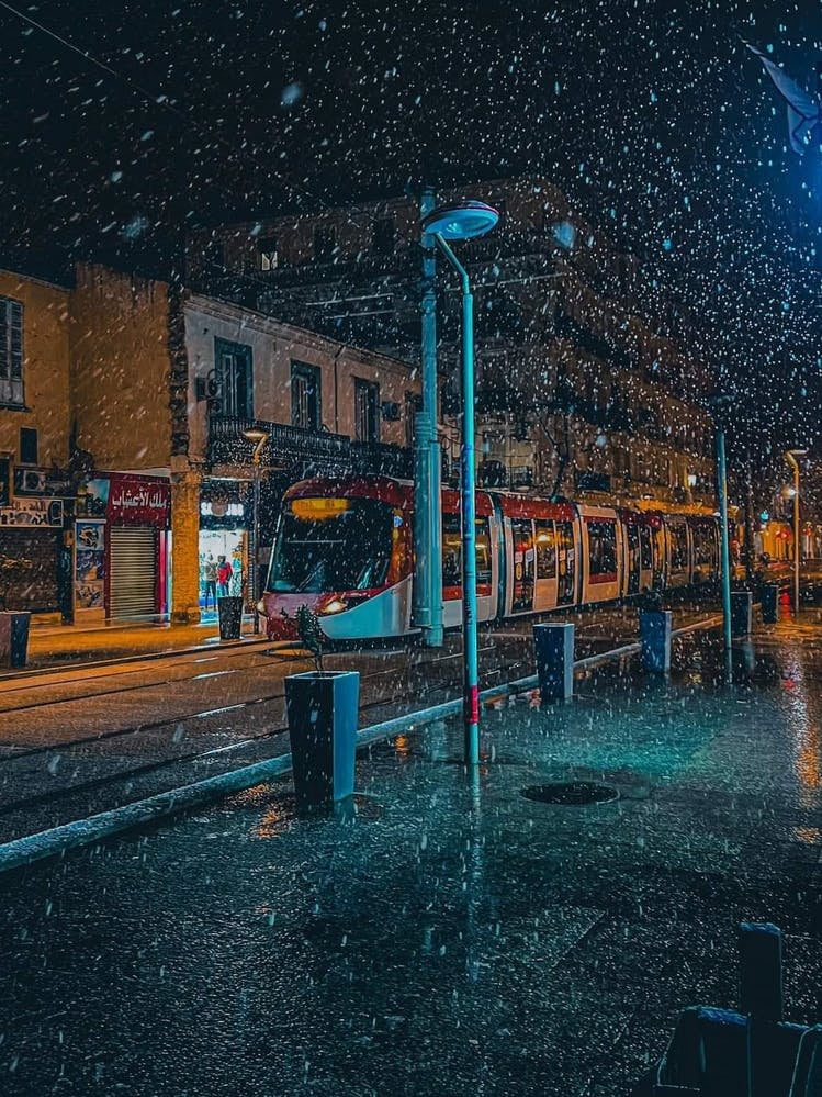 Snow Falling On A City Street