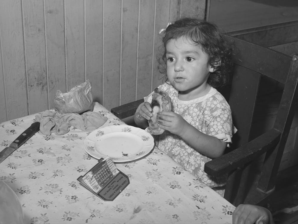Little Mexican Girl Eating Enchilada For Lunch San Diego, California By Russell Lee