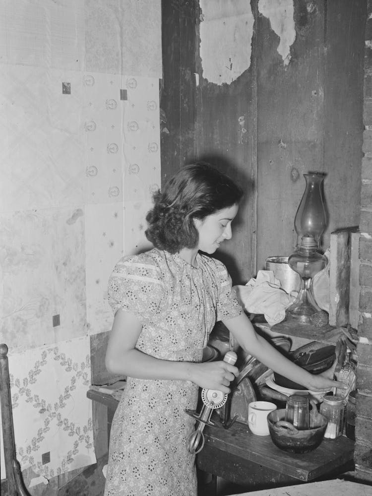 Mexican Girl Straightening Corner Of Her Kitchen, San Antonio, Texas By Russell Lee