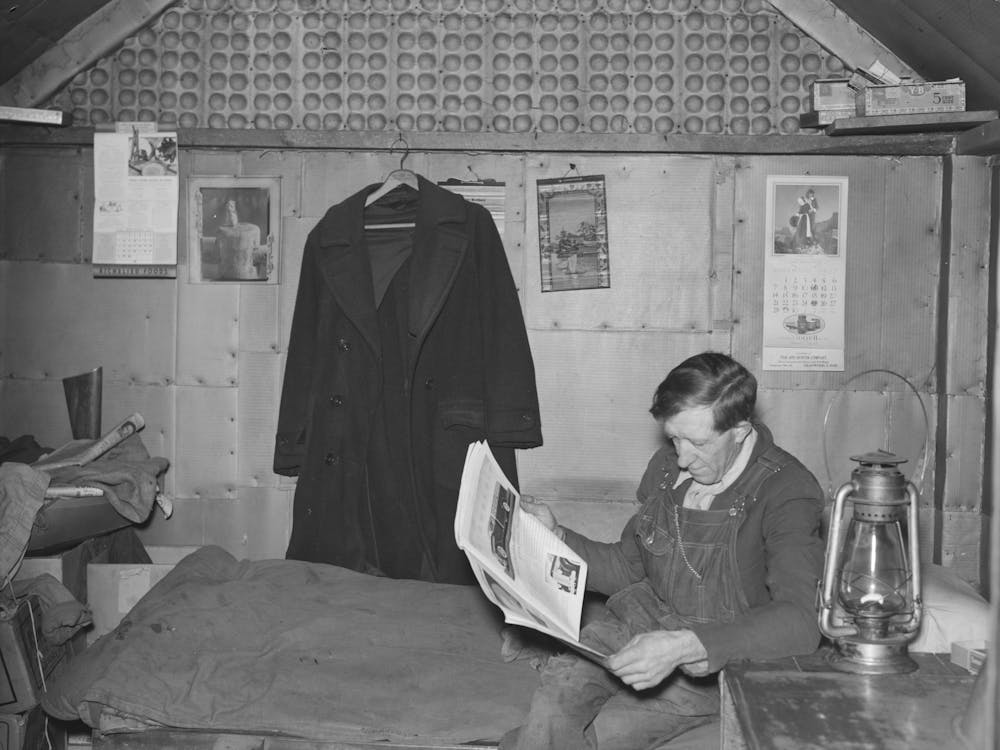 Gold Miner Reading In His Shack, Two Bit Creek, South Dakota By Russell Lee