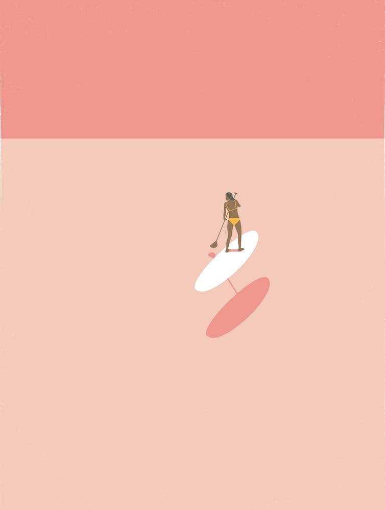 Minimal paddleboarding woman in pink
