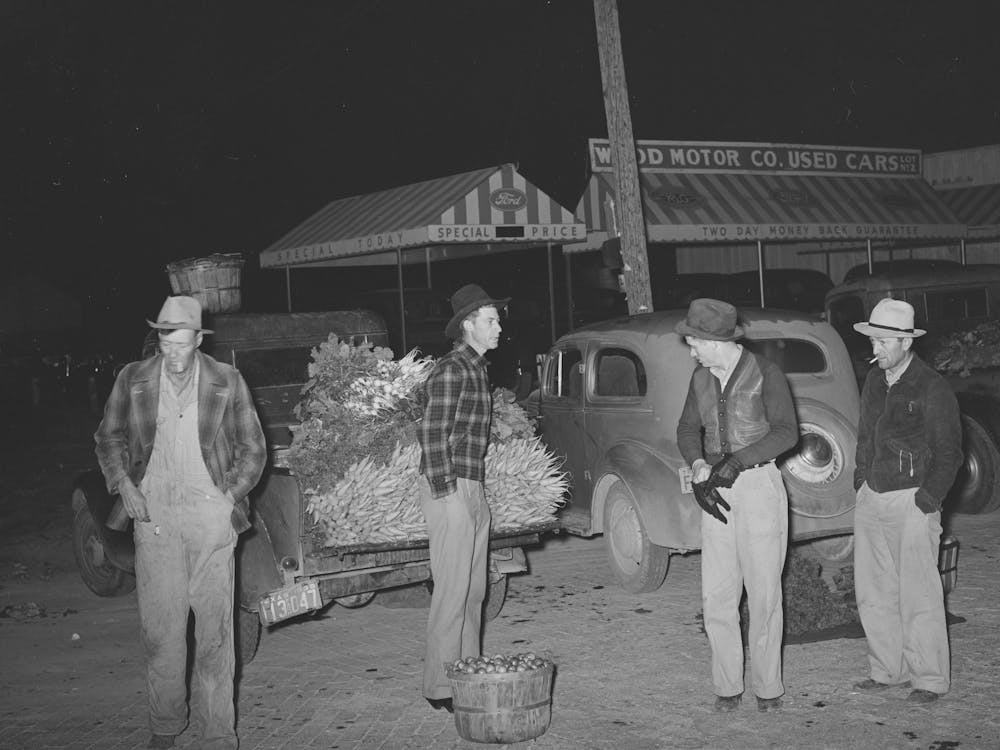 Early Morning Vegetable Market, San Angelo, Texas, The Farmers With Their Hands In Their Pockets Show How Cold