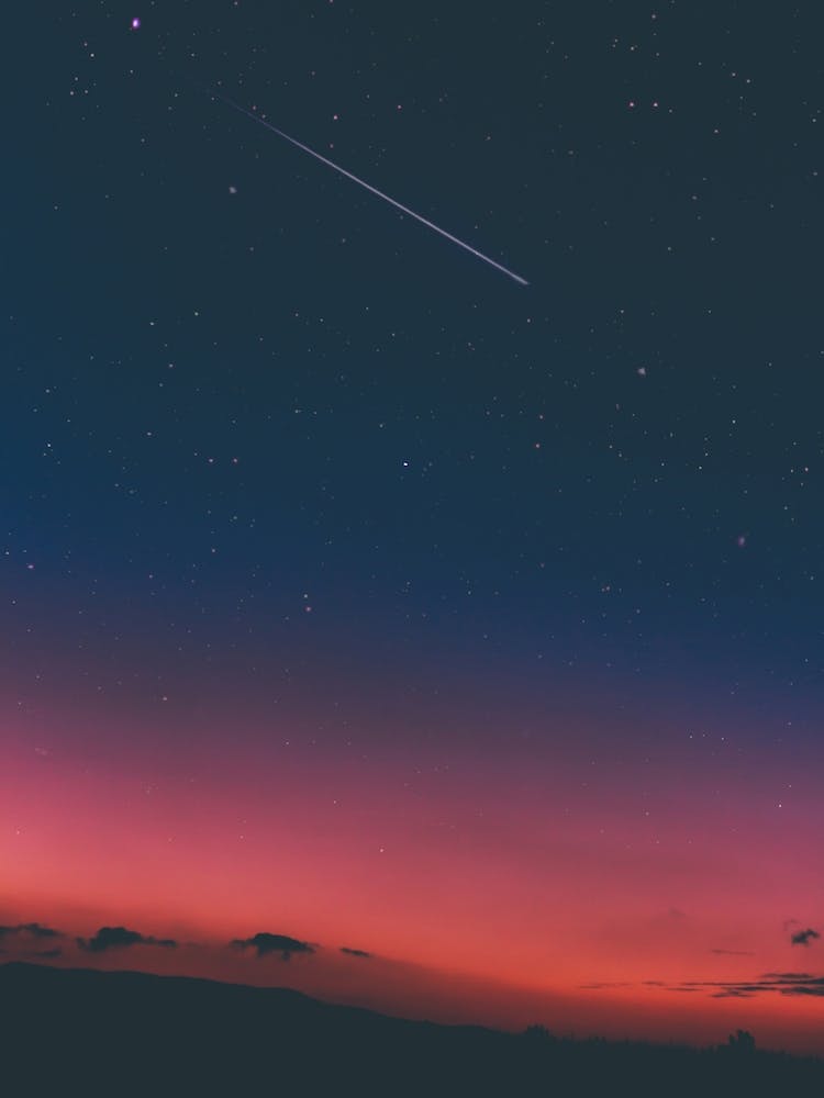 Shooting Star In A Red Sky