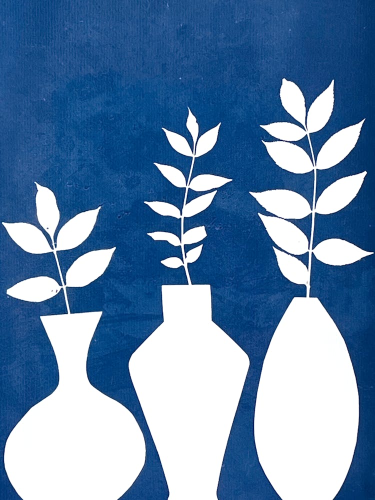 Three white Vases with leaves