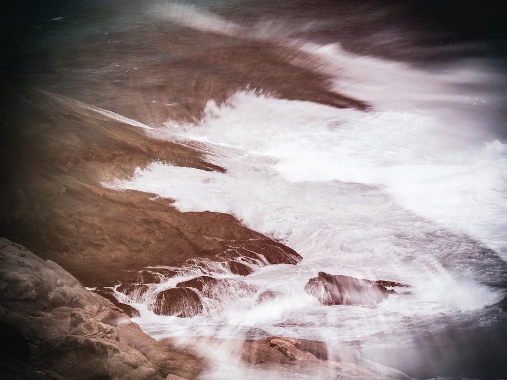 Waves Crashing Against A Rocky Shore