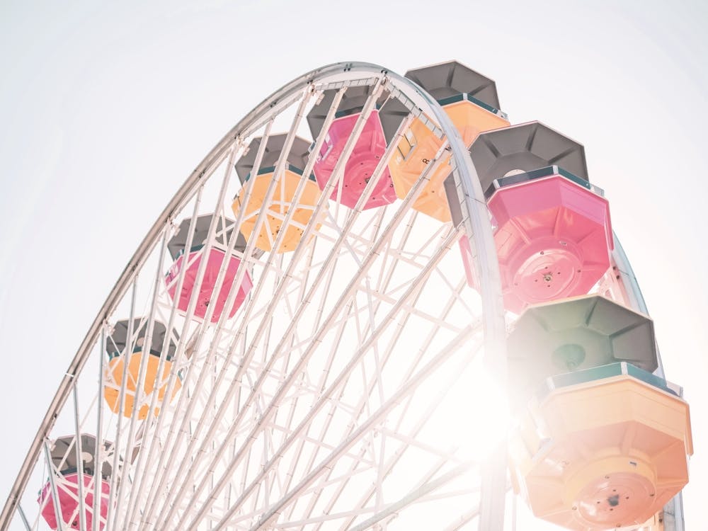Los Angeles, USA I Ferris wheel in Santa Monica under California sun with a pastel summer aesthetic for a minimalist geometric composition of a retro vintage photography taken with a film camera