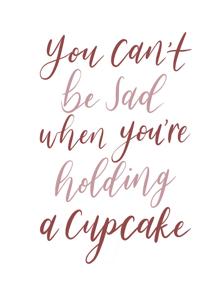 Man kann nicht traurig sein, wenn man einen Cupcake hält Druck