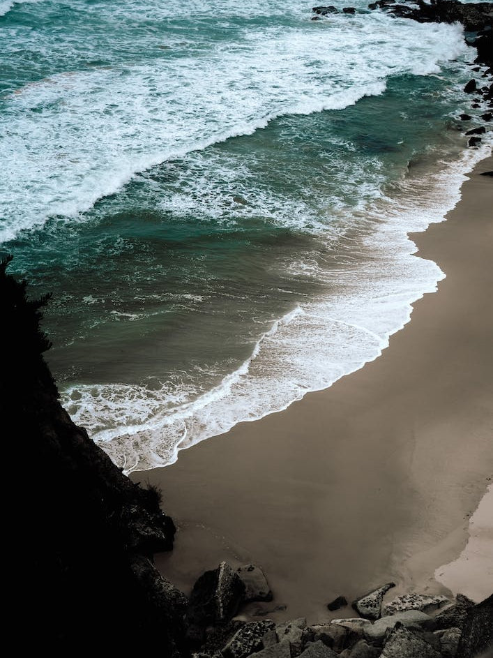 Dark Beach, Bright Waves And Blue Sea Aerial Ocean View Colour Travel And Nature Photography Portrait