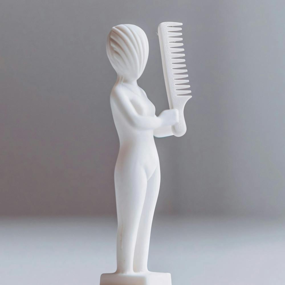 Woman Holding A Comb
