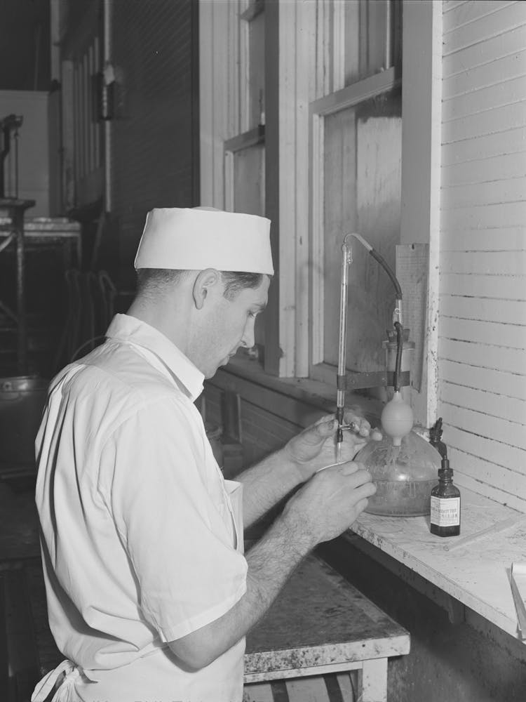 Making Acidity Test At The Tillamook Cheese Plant, Tillamook, Oregon By Russell Lee