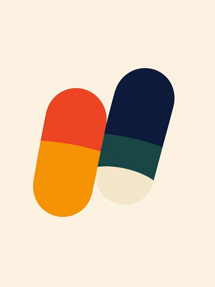 Two Pills On A White Background