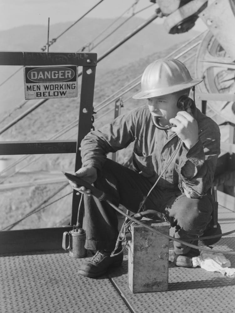 Untitled Photo, Possibly Related To Workman Keeps In Touch With Various Construction Points By Telephone At