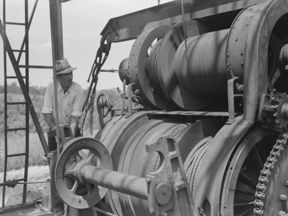 Untitled Photo, Possibly Related To Roughneck Tying Piece Of String Around Cable To Determine Depth To Which Bail
