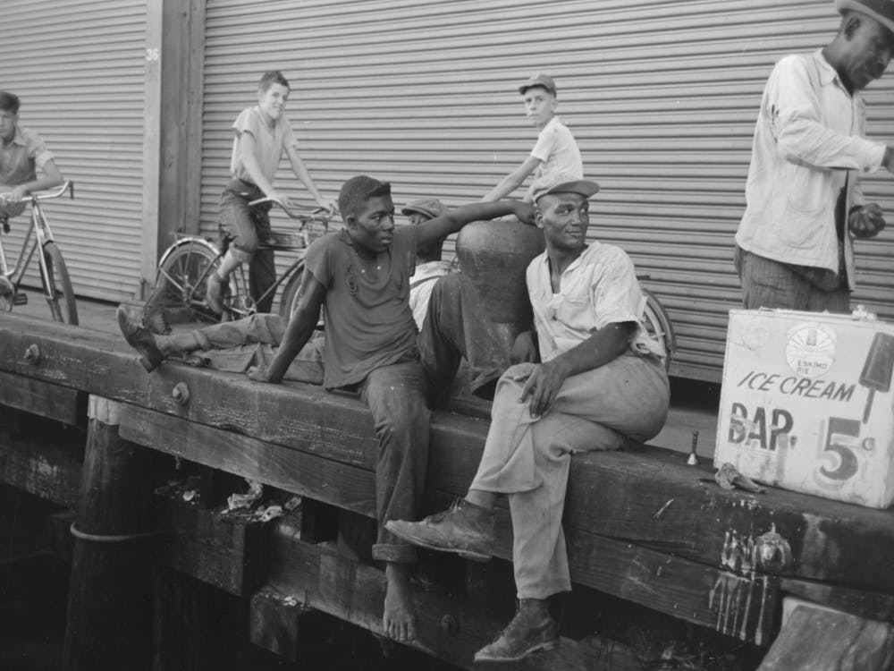 People Sitting On Dock, New Orleans, Louisiana By Russell Lee