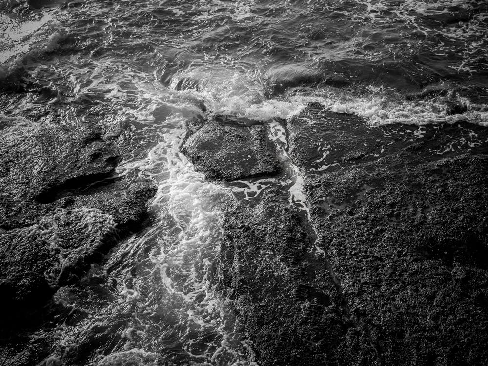 White Sea Foam And Black Rocks Surface 2