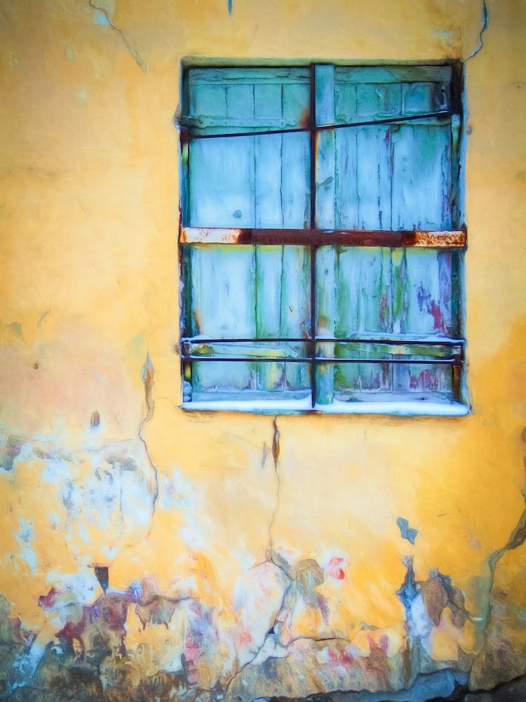 Blue Shutters And Yellow Wall