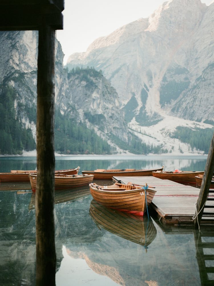 Lago Di Braies Boats At A Lake In The Dolomites Italy