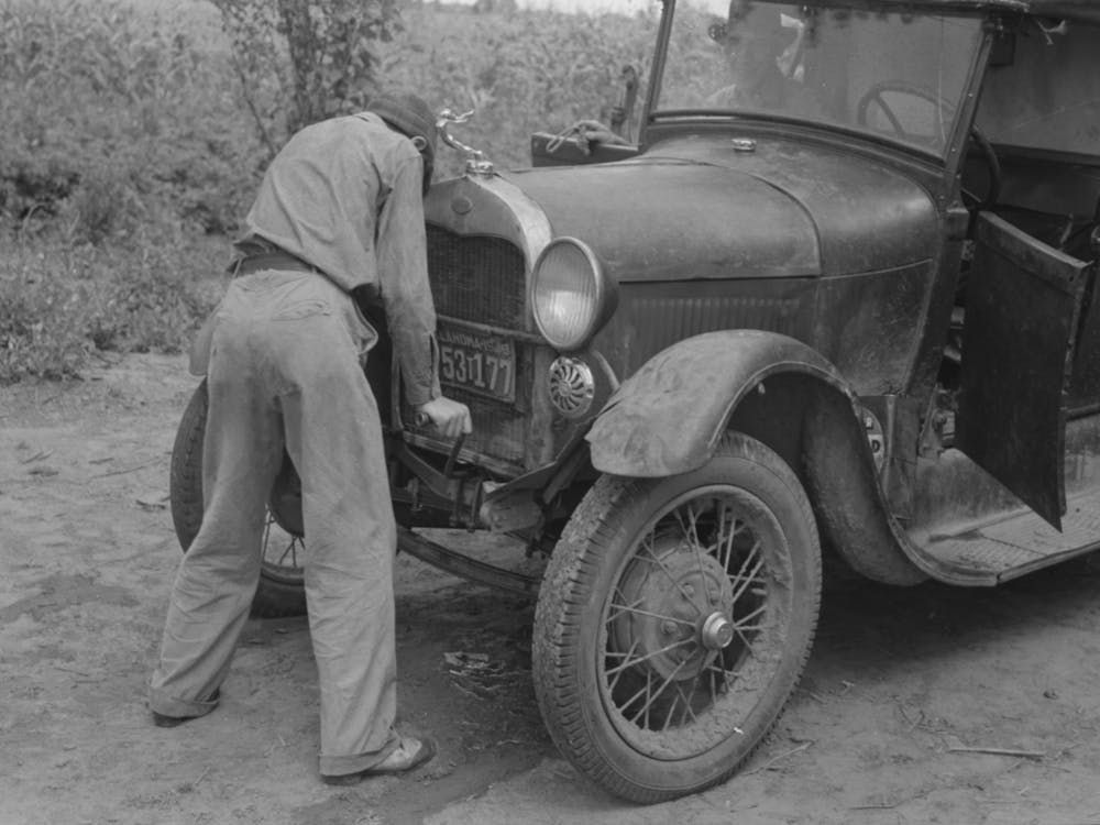 Migrant Boy Getting Ready To Crank His Car, Muskogee, Oklahoma By Russell Lee