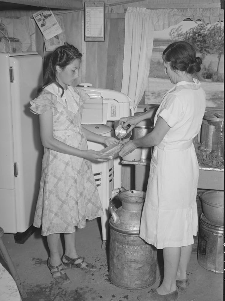 Mrs, Browning And Her Daughter Fill Ice Trays For Electrical Refrigeration, They Are Fsa (Farm Security Administration)