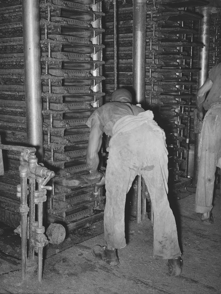 Working On The Hydraulic Presses At Cotton Seed Mill, Mclennan County, Texas By Russell Lee