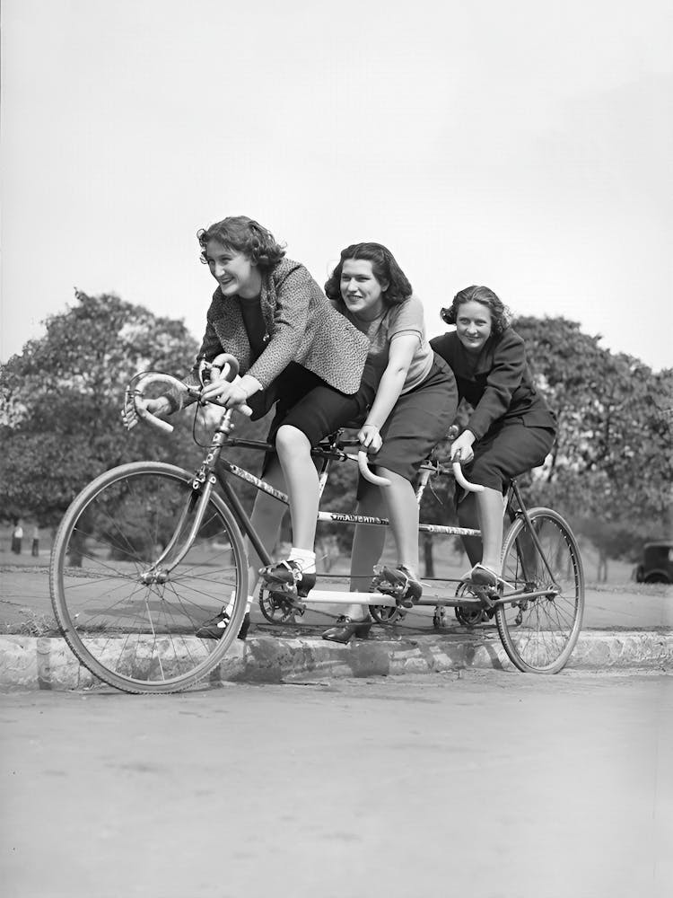 Three Women On A Bicycle, Vintage Black and White Old Photo